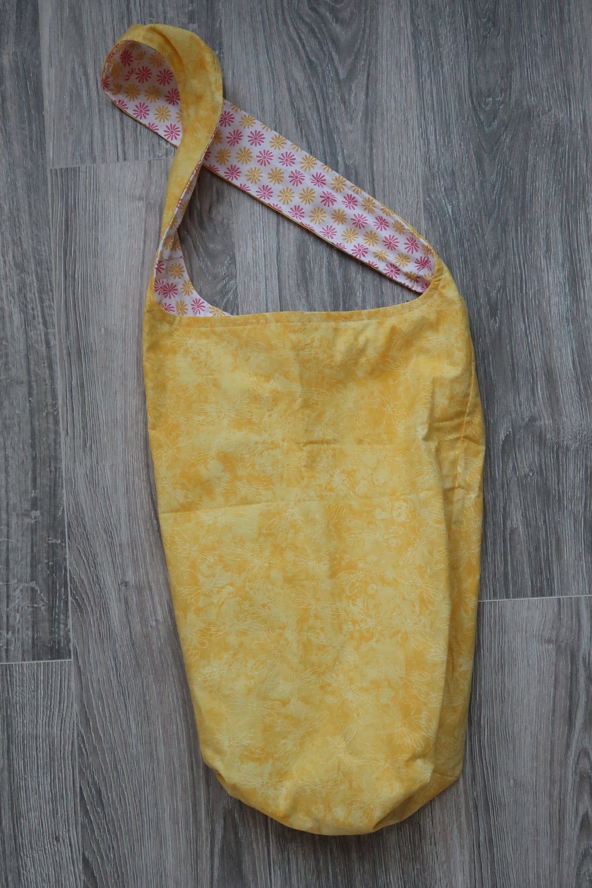 Yoga mat bag, cotton fabric Yellow floral pattern, inner lining fabric with with yellow and pink flowers.