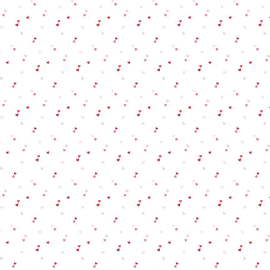 cotton fabric Pattern of small red and pink hearts on a white background
