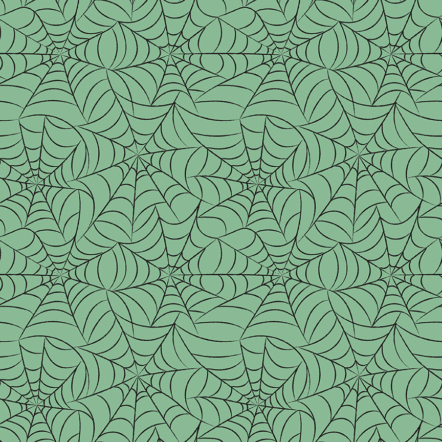 cotton fabric Frank and Friends Halloween themed spider web repeating pattern on a green background