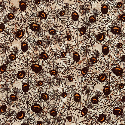Fabric pattern Mocha me Crazy: hand-stamped spiderweb with jack o lantern faces on a light tan background from The Whispering Hollows collection which features fun Halloween images, with colors invoking midnight skies, as well as favorite seasonal hues. The Batiks Collections by Riley Blake are produced in state-of-the-art facilities with the best Tjap designers and makers, color experts, and stamp prodigies.