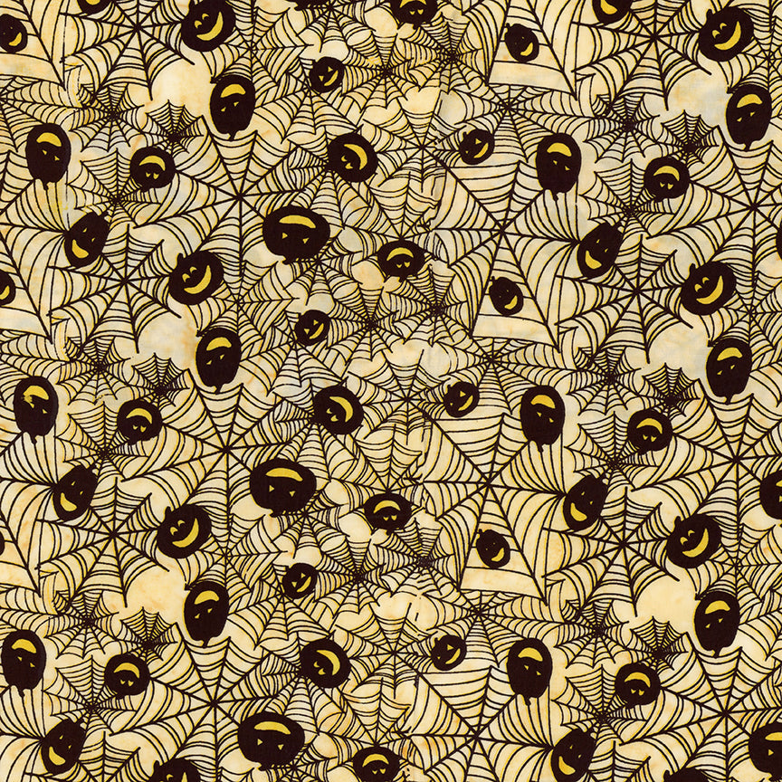 Fabric pattern Bees whisper: hand-stamped spiderweb with jack o lantern faces on a light yellow background from The Whispering Hollows collection which features fun Halloween images, with colors invoking midnight skies, as well as favorite seasonal hues. The Batiks Collections by Riley Blake are produced in state-of-the-art facilities with the best Tjap designers and makers, color experts, and stamp prodigies.
