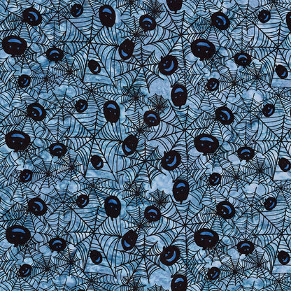 Fabric pattern Dreamcatcher: hand-stamped spiderweb with jack o lantern faces on a blue background from The Whispering Hollows collection which features fun Halloween images, with colors invoking midnight skies, as well as favorite seasonal hues. The Batiks Collections by Riley Blake are produced in state-of-the-art facilities with the best Tjap designers and makers, color experts, and stamp prodigies.