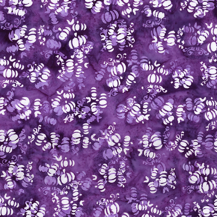 Fabric pattern Grape Soda: hand dyed deep purple fabrics with scattered pumpkin shapes from The Whispering Hollows collection which features fun Halloween images, with colors invoking midnight skies, as well as favorite seasonal hues. The Batiks Collections by Riley Blake are produced in state-of-the-art facilities with the best Tjap designers and makers, color experts, and stamp prodigies.