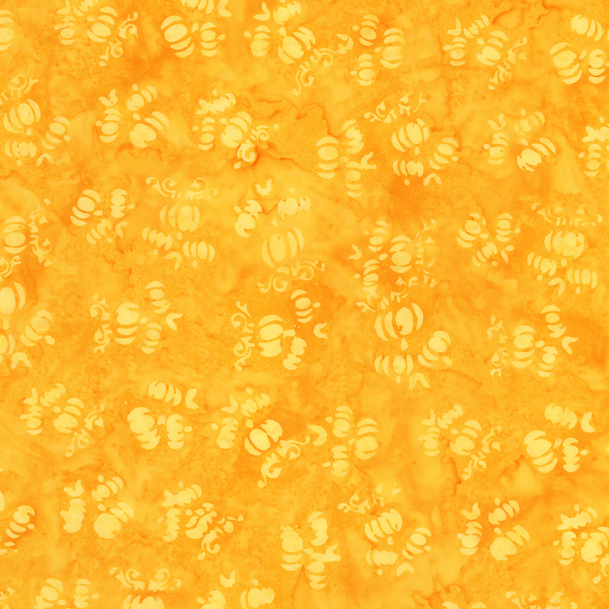 Fabric pattern marigold: hand dyed orange with scattered pumpkin shapes from The Whispering Hollows collection which features fun Halloween images, with colors invoking midnight skies, as well as favorite seasonal hues. The Batiks Collections by Riley Blake are produced in state-of-the-art facilities with the best Tjap designers and makers, color experts, and stamp prodigies.