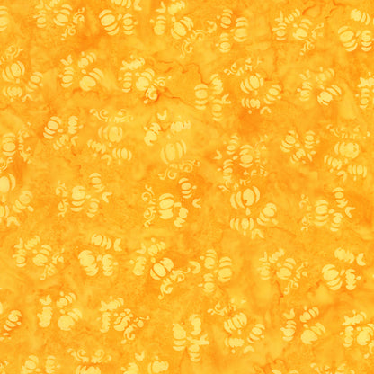 Fabric pattern marigold: hand dyed orange with scattered pumpkin shapes from The Whispering Hollows collection which features fun Halloween images, with colors invoking midnight skies, as well as favorite seasonal hues. The Batiks Collections by Riley Blake are produced in state-of-the-art facilities with the best Tjap designers and makers, color experts, and stamp prodigies.