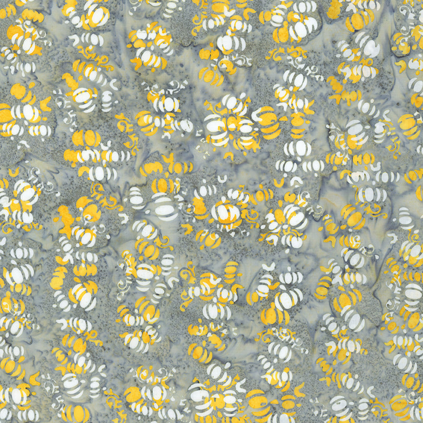 Fabric pattern Moonbeam: hand dyed grey with yellows with scattered pumpkin shapes from The Whispering Hollows collection which features fun Halloween images, with colors invoking midnight skies, as well as favorite seasonal hues. The Batiks Collections by Riley Blake are produced in state-of-the-art facilities with the best Tjap designers and makers, color experts, and stamp prodigies.