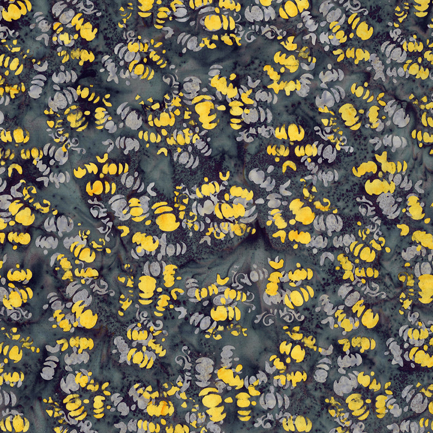 Fabric pattern Whispering Moon: hand dyed dark grey with yellows with scattered pumpkin shapes from The Whispering Hollows collection which features fun Halloween images, with colors invoking midnight skies, as well as favorite seasonal hues. The Batiks Collections by Riley Blake are produced in state-of-the-art facilities with the best Tjap designers and makers, color experts, and stamp prodigies.
