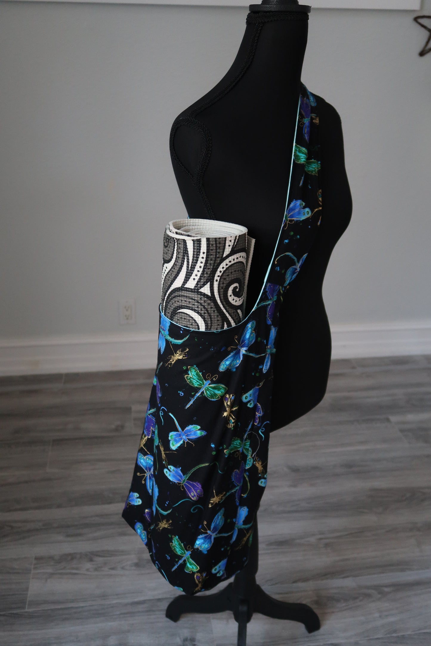 yoga mat bag Black fabric with colorful dragonfly pattern , interior lining is light floral pattern