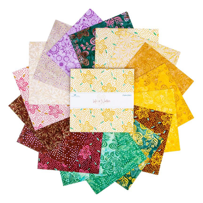 The Expressions Batiks - Ink & Nectar collection by Riley Blake Designs features authentic hand-dyed fabrics with double tjap designs. Known for their sophisticated texture, these cotton and rayon prints incorporate small pops of color over diverse background shades. These patterns frequently combine overlapping organic motifs like florals, leaves, and abstract line work onto these base colors.