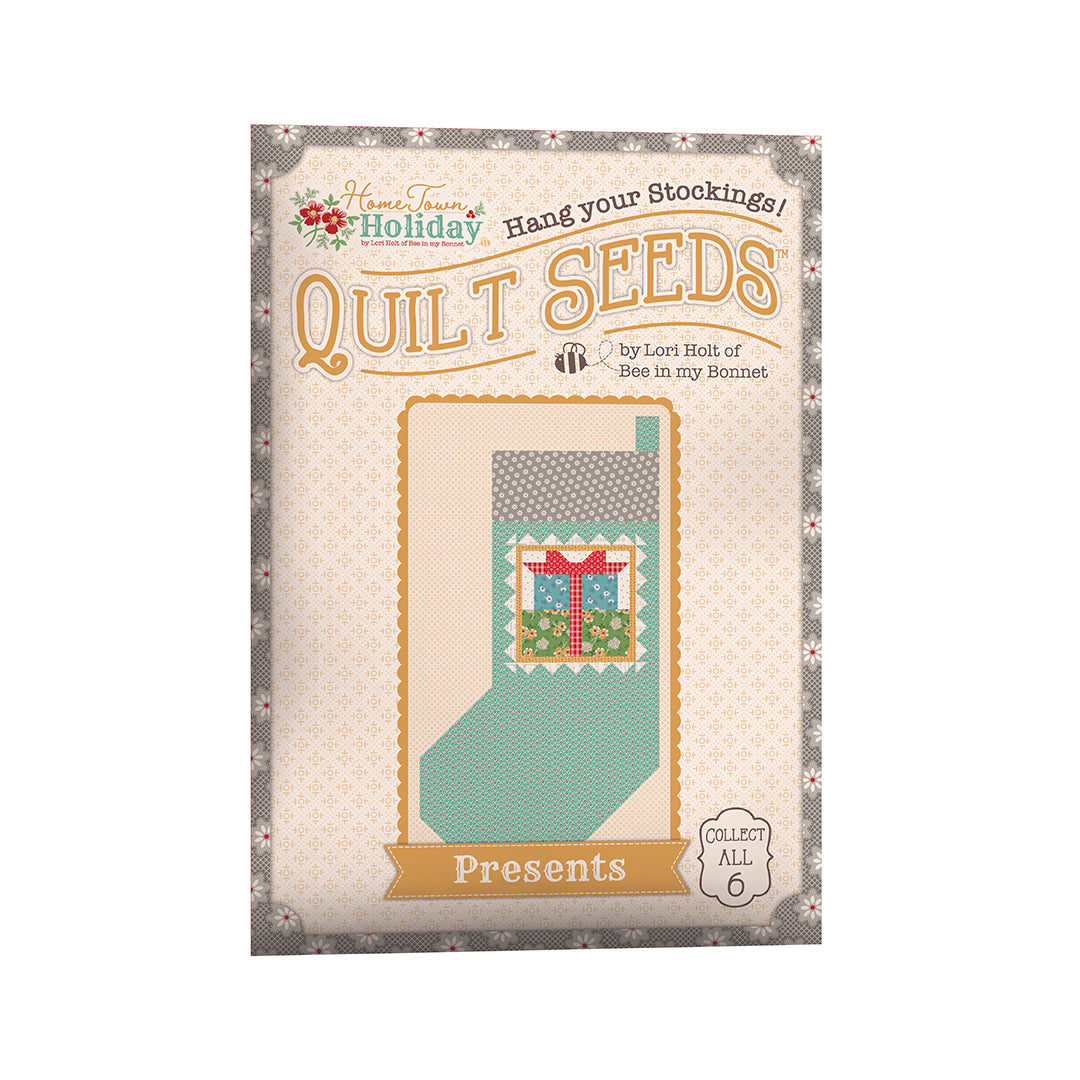 The Home Town Holiday Quilt Seeds™ Patterns by Lori Holt of Bee in my Bonnet is a pattern series for 6 different stocking quilt blocks. Each seed packet has instructions to make 1 block – all you have to do is add fabric. A paper pattern is included in each packet. No templates are required. Each block finishes at 22" x 40" and uses traditional piecing techniques.  Tutorial available You Tube Lori Holt  the Home Town Holiday Quilt Seeds™   Seed packet size is approximately 6 1/2" x 9 1/2".