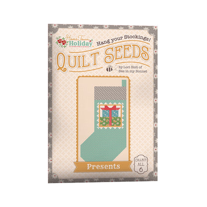 The Home Town Holiday Quilt Seeds™ Patterns by Lori Holt of Bee in my Bonnet is a pattern series for 6 different stocking quilt blocks. Each seed packet has instructions to make 1 block – all you have to do is add fabric. A paper pattern is included in each packet. No templates are required. Each block finishes at 22" x 40" and uses traditional piecing techniques.  Tutorial available You Tube Lori Holt  the Home Town Holiday Quilt Seeds™   Seed packet size is approximately 6 1/2" x 9 1/2".
