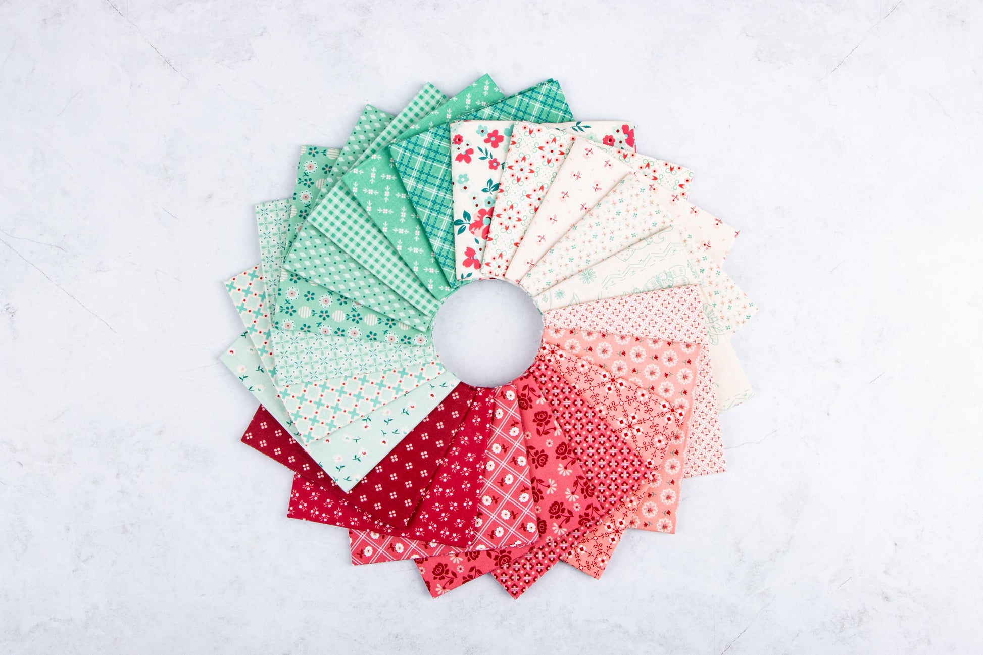 The Strawberry Crush Sew Along Quilt Kit includes the Strawberry Crush Sew Simple Shapes™ and fabric for quilt top and binding. Backing not included. Fabric featured is Berry & Sage by Lori Holt of Bee in my Bonnet. Pattern is also by Lori Holt. Finished size is 66 1/2" x 73 1/2". 
Kit comes in a strawberry-shaped box. Box size is approximately 13 1/2" x 11 3/4" x 3 1/4". 

The Sew Along Guide is included in the  kit but you can also go to Lori Holt's blog A Bee in my Bonnet.