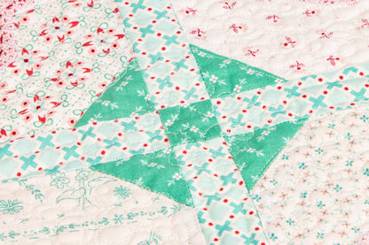 The Strawberry Crush Sew Along Quilt Kit includes the Strawberry Crush Sew Simple Shapes™ and fabric for quilt top and binding. Backing not included. Fabric featured is Berry & Sage by Lori Holt of Bee in my Bonnet. Pattern is also by Lori Holt. Finished size is 66 1/2" x 73 1/2". 
Kit comes in a strawberry-shaped box. Box size is approximately 13 1/2" x 11 3/4" x 3 1/4". 

The Sew Along Guide is included in the  kit but you can also go to Lori Holt's blog A Bee in my Bonnet.