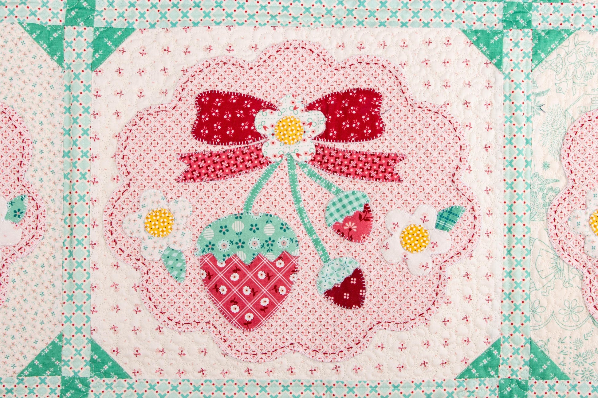 The Strawberry Crush Sew Along Quilt Kit includes the Strawberry Crush Sew Simple Shapes™ and fabric for quilt top and binding. Backing not included. Fabric featured is Berry & Sage by Lori Holt of Bee in my Bonnet. Pattern is also by Lori Holt. Finished size is 66 1/2" x 73 1/2". 
Kit comes in a strawberry-shaped box. Box size is approximately 13 1/2" x 11 3/4" x 3 1/4". 

The Sew Along Guide is included in the  kit but you can also go to Lori Holt's blog A Bee in my Bonnet.