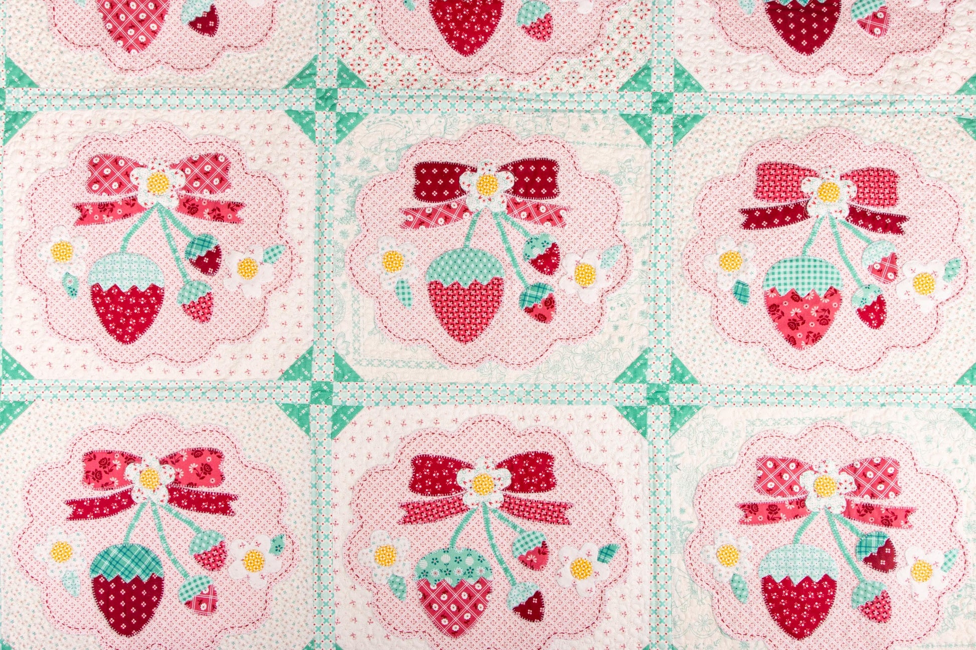 The Strawberry Crush Sew Along Quilt Kit includes the Strawberry Crush Sew Simple Shapes™ and fabric for quilt top and binding. Backing not included. Fabric featured is Berry & Sage by Lori Holt of Bee in my Bonnet. Pattern is also by Lori Holt. Finished size is 66 1/2" x 73 1/2". 
Kit comes in a strawberry-shaped box. Box size is approximately 13 1/2" x 11 3/4" x 3 1/4". 

The Sew Along Guide is included in the  kit but you can also go to Lori Holt's blog A Bee in my Bonnet.