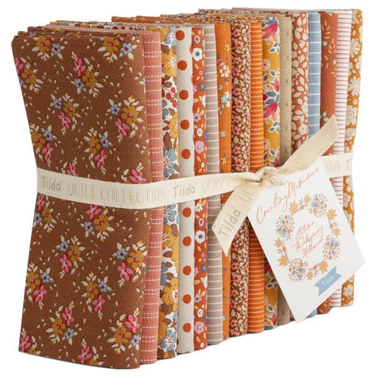 The Tilda Creating Memories Autumn collection (part of the Seasonal Basics range) features 16 small-patterned fabrics in warm tones of ginger, saffron, brown, and rust, with touches of blue-grey and khaki. Designed by Tone Finnanger, the collection blends 9 printed and 7 woven cotton designs—including dainty florals, delicate stripes, and timeless plaids—ideal for quilting, softies, and  crafting.