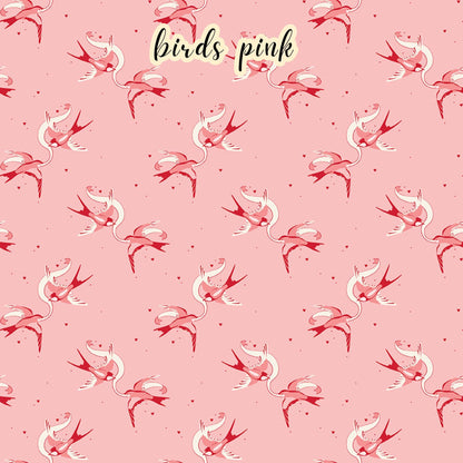 fabric collection Letters to Cupid, 100% cotton the birds Cream pattern is a pair of red and pink love birds with a ribbon on a pink background 