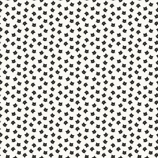 cotton fabric Pattern of small black cat faces on a white background 