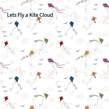 cotton fabric collection spoonful of sugar this pattern is of colorful kites in various shapes and colors, including red, green, blue, and purple, against a white background. The kites are accompanied by stylized clouds, birds, and decorative swirls. 