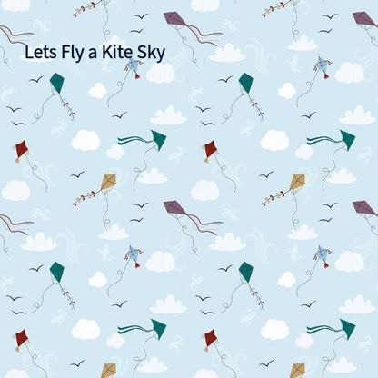 cotton fabric collection spoonful of sugar this pattern is of colorful kites in various shapes and colors, including red, green, blue, and purple, against a light blue background. The kites are accompanied by stylized clouds, birds, and decorative swirls. 