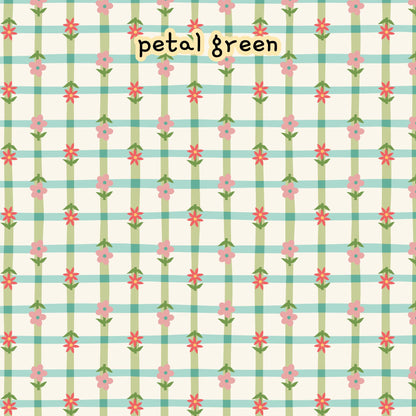 Fabric collection Lovebugs 100% organic cotton fabric with a pattern featuring pink and red flowers with green stems and leaves, set against a light background with a grid of light green and blue stripes. Quilting, crafts, home decor, apparel sewing