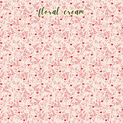 The Letters to Cupid fabric collection, the floral creme pattern features red florals and vines with hearts on a creme colored background. This 100% cotton quilting fabric is 43"/44" wide and is suitable for quilting, apparel, and home decor.