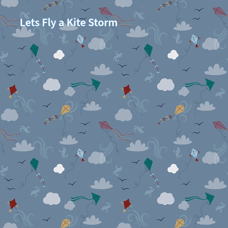cotton fabric collection spoonful of sugar this pattern is of colorful kites in various shapes and colors, including red, green, blue, and purple, against a blue background. The kites are accompanied by stylized clouds, birds, and decorative swirls. 