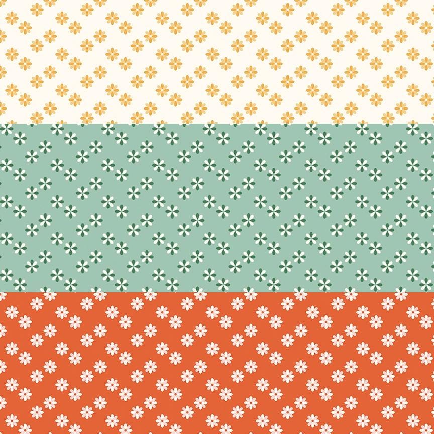 cotton fabric meadow moments collection three patterns with small daisies on white green and rust colored  backgrounds
