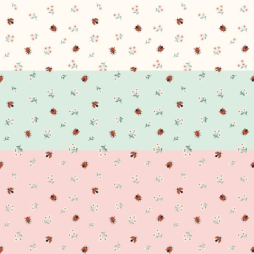 cotton fabric meadow moments collection three patterns with small ladybugs and daisies on white , green and pink  backgrounds