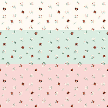 cotton fabric meadow moments collection three patterns with small ladybugs and daisies on white , green and pink  backgrounds