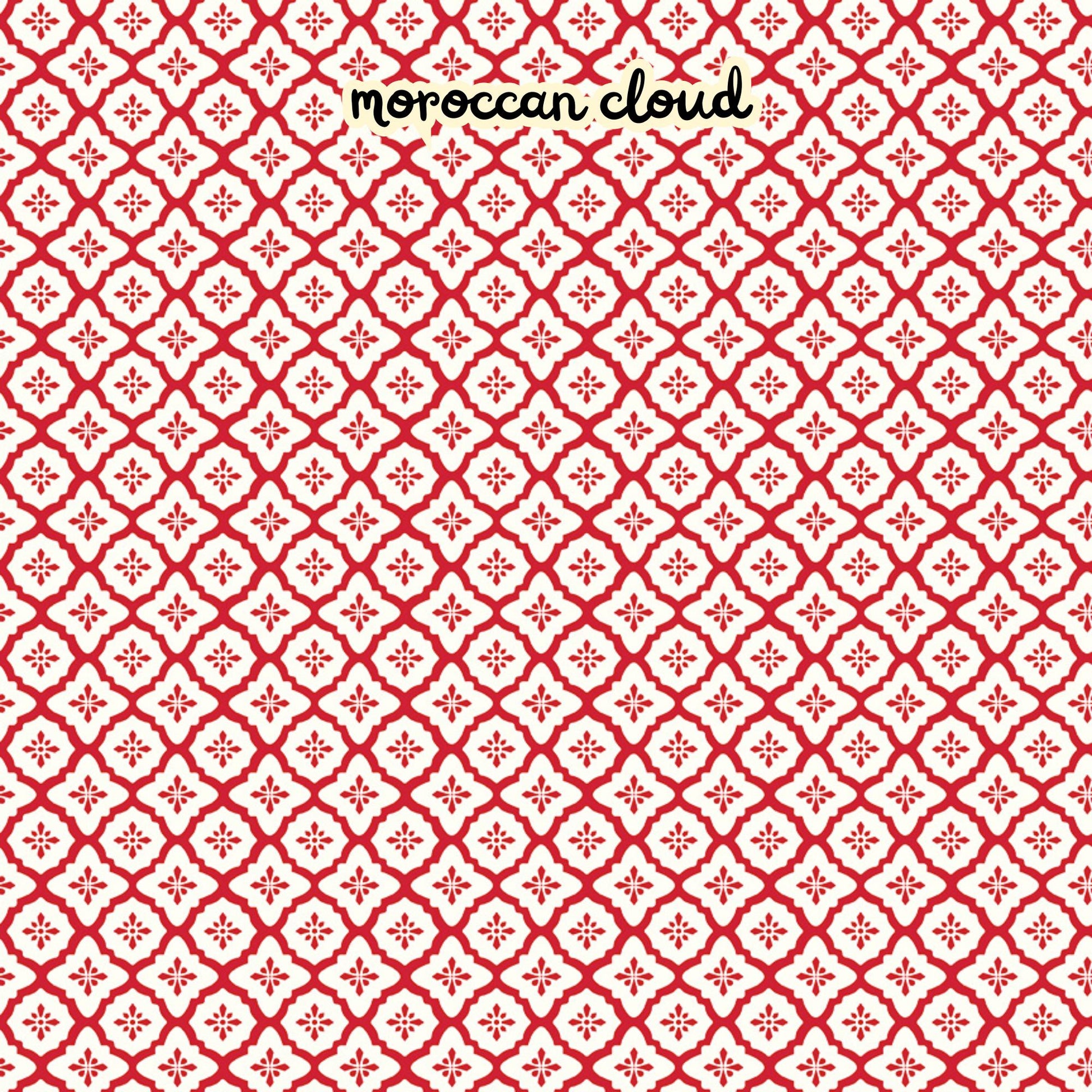 100% cotton fabric collection Radiant Ruby. The pattern features a repeating Moroccan-inspired tile motif in  white set against  a red set against a background. Collection is a vibrant "showstopper in scarlet" a two-tone collection which uses only "Schoolhouse" (red) and "Cloud" (off-white) to create a striking aesthetic inspired by the brilliance of a ruby gemstone.  