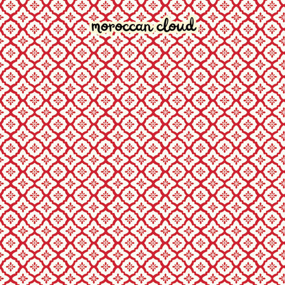 100% cotton fabric collection Radiant Ruby. The pattern features a repeating Moroccan-inspired tile motif in  white set against  a red set against a background. Collection is a vibrant "showstopper in scarlet" a two-tone collection which uses only "Schoolhouse" (red) and "Cloud" (off-white) to create a striking aesthetic inspired by the brilliance of a ruby gemstone.  