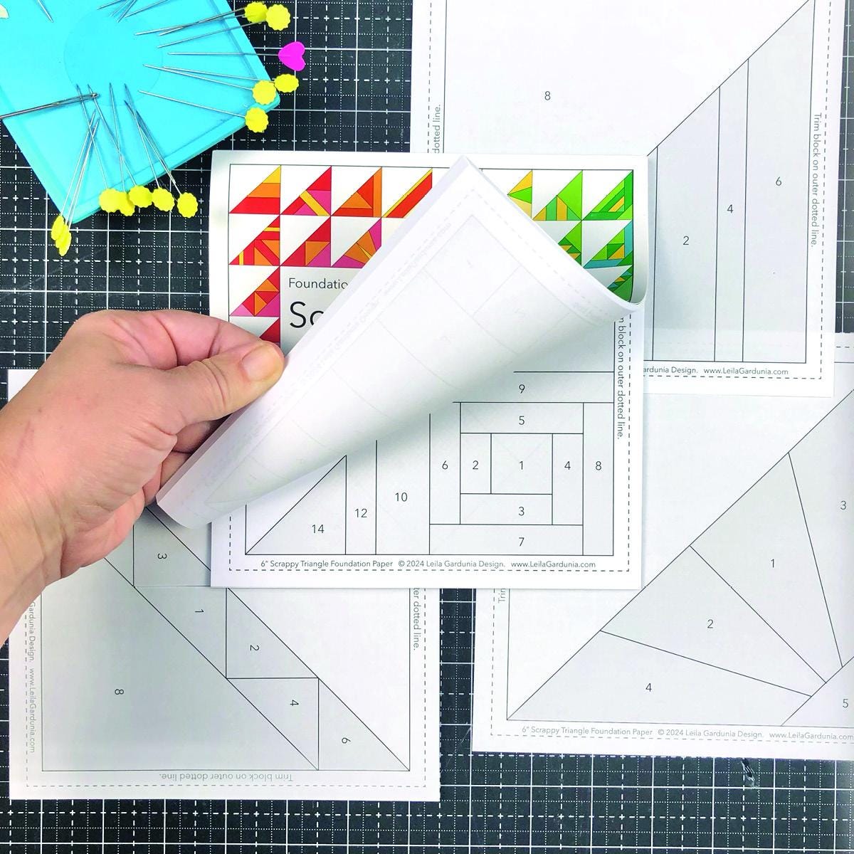 The pre-printed Scrappy Triangle foundation paper pieced pattern pad pad has 50 different Scrappy Triangle designs printed on lightweight foundation paper so they are easy to see through and remove. The Scrappy Triangle foundation pad includes  Supply/fabric requirements A link to an in-depth tutorial and video. Best for using your pile of scraps