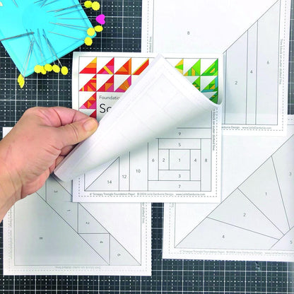 The pre-printed Scrappy Triangle foundation paper pieced pattern pad pad has 50 different Scrappy Triangle designs printed on lightweight foundation paper so they are easy to see through and remove. The Scrappy Triangle foundation pad includes  Supply/fabric requirements A link to an in-depth tutorial and video. Best for using your pile of scraps