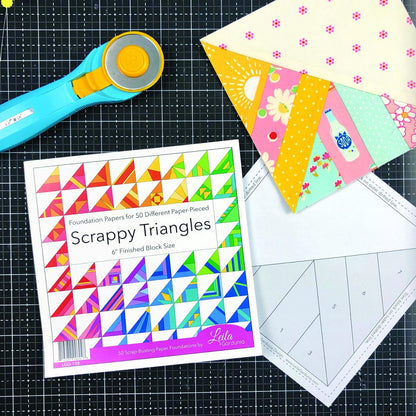 The pre-printed Scrappy Triangle foundation paper pieced pattern pad pad has 50 different Scrappy Triangle designs printed on lightweight foundation paper so they are easy to see through and remove. The Scrappy Triangle foundation pad includes  Supply/fabric requirements A link to an in-depth tutorial and video. Best for using your pile of scraps