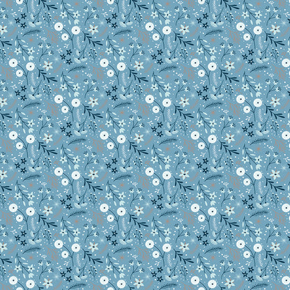 Winter Magic by Dani Mogstad for Riley Blake Designs image features floral blue which are randomly placed Wintry flowers, leaves, and berries. The collection is a cozy, charming fabric line featuring arctic animals, snowy forests, and delicate florals in a palette of navy, aqua, blue, white, and warm tea-dye brown. The collection includes prints of snowflakes, sweaters, and trees, centered around a "everything is magical when it snows" panel