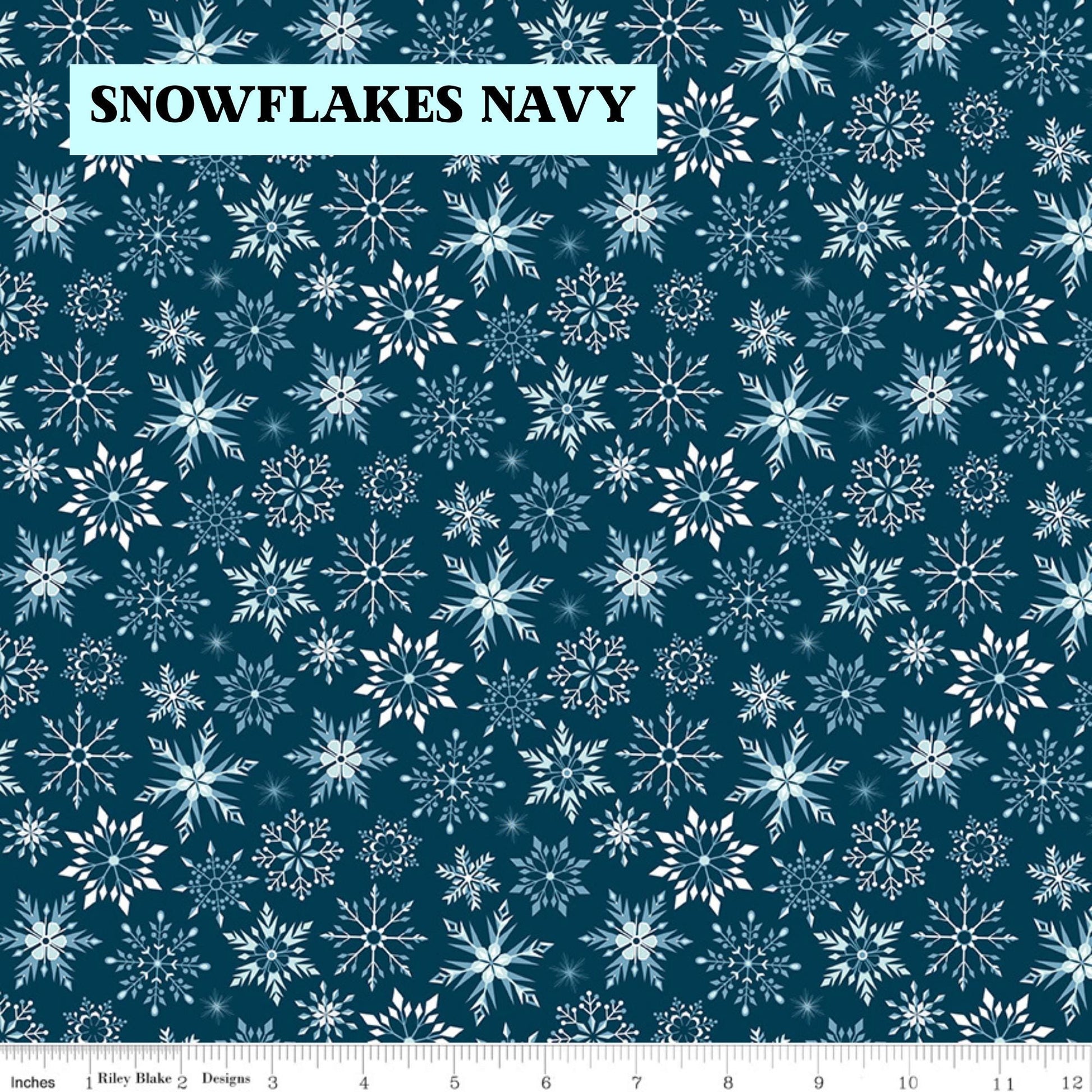 Winter Magic by Dani Mogstad for Riley Blake Designs image features snowflakes navy detailed snowflake in different patterns. The collection is a cozy, charming fabric line featuring arctic animals, snowy forests, and delicate florals in a palette of navy, aqua, blue, white, and warm tea-dye brown. The collection includes prints of snowflakes, sweaters, and trees, centered around a "everything is magical when it snows" panel