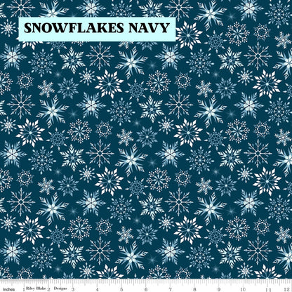 Winter Magic by Dani Mogstad for Riley Blake Designs image features snowflakes navy detailed snowflake in different patterns. The collection is a cozy, charming fabric line featuring arctic animals, snowy forests, and delicate florals in a palette of navy, aqua, blue, white, and warm tea-dye brown. The collection includes prints of snowflakes, sweaters, and trees, centered around a "everything is magical when it snows" panel