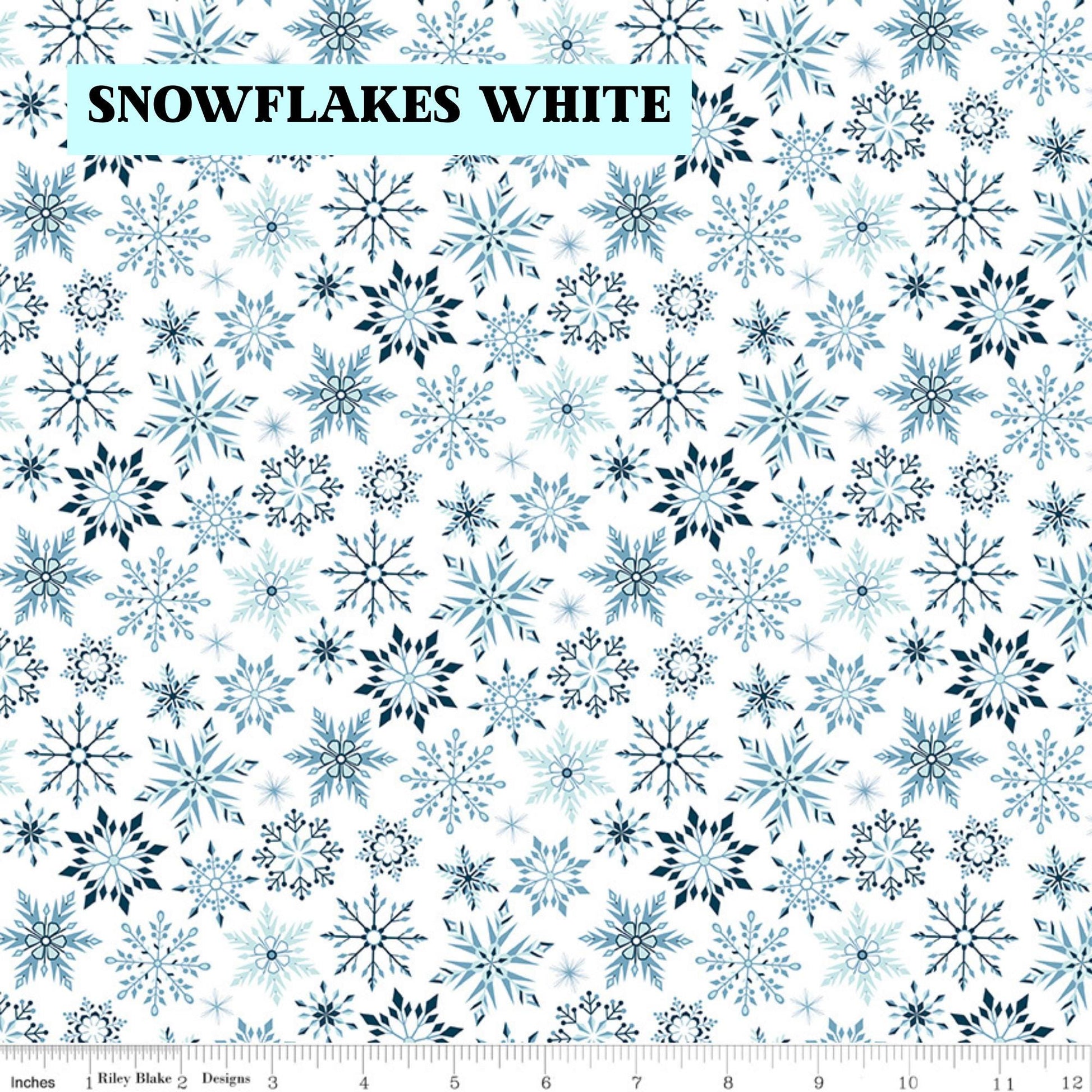 Winter Magic by Dani Mogstad for Riley Blake Designs image features snowflakes white detailed snowflake in different patterns. The collection is a cozy, charming fabric line featuring arctic animals, snowy forests, and delicate florals in a palette of navy, aqua, blue, white, and warm tea-dye brown. The collection includes prints of snowflakes, sweaters, and trees, centered around a "everything is magical when it snows" panel